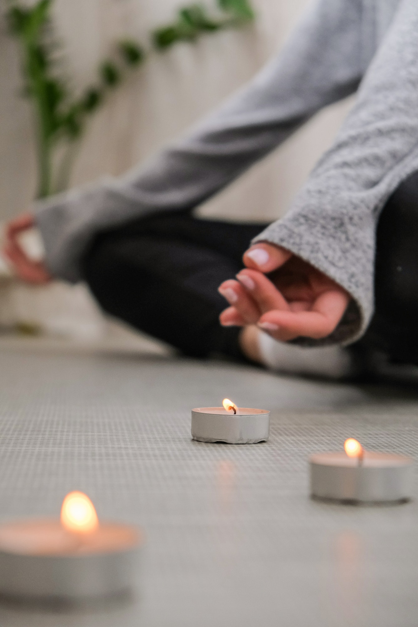 Close-up. Woman doing yoga exercise at home. Mindfulness meditation. Relax breathe easy pose gym hea